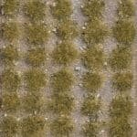 Grasbüschel mit Steinen